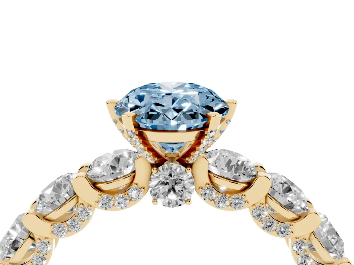 Fancy Blue Oval Cut Diamond Side Stone Engagement Ring with Four-Prong Setting Yellow gold