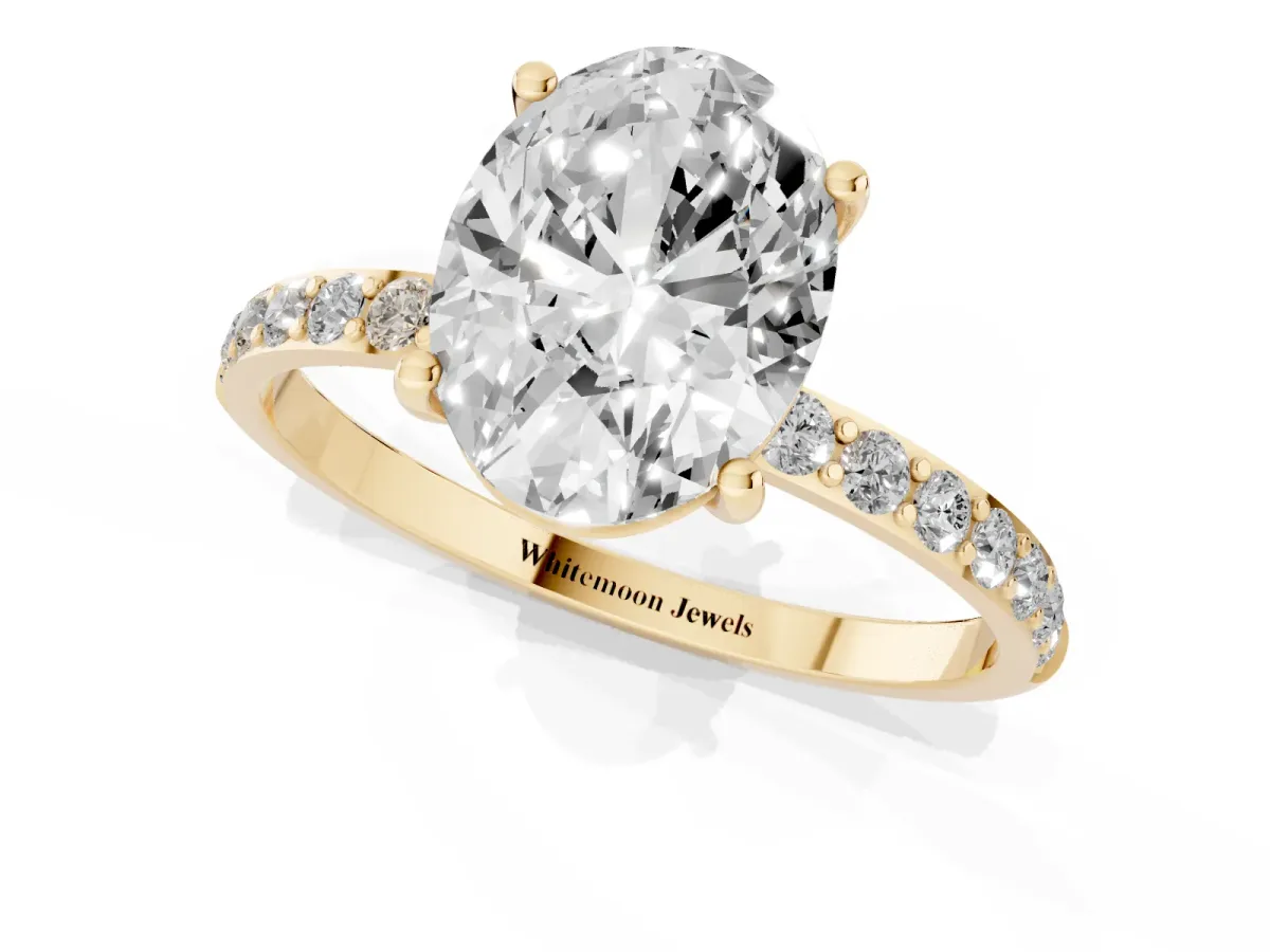 Oval Cut Diamond Solitaire Ring with Round Pavé Shoulders and Prong Setting Yellow gold