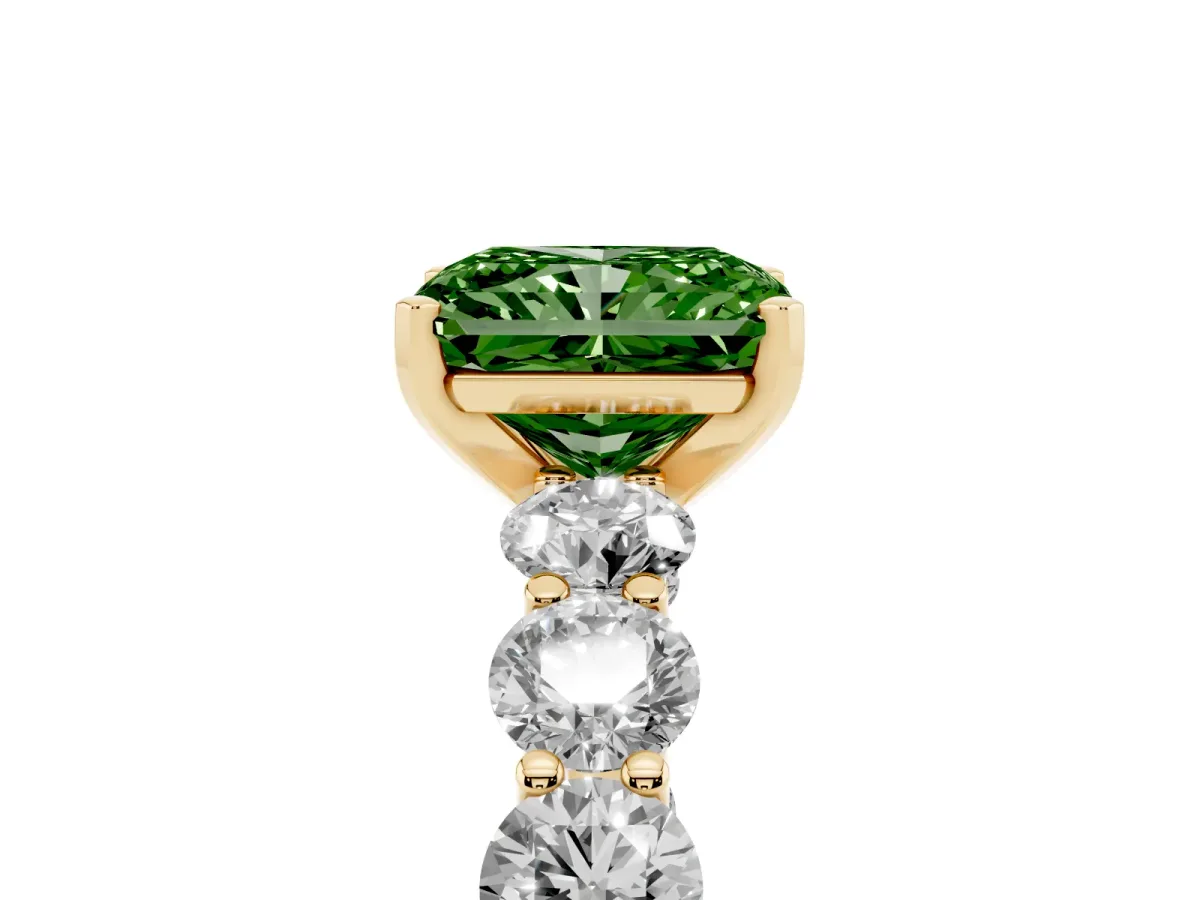 Fancy Green Radiant Cut Diamond Prong Setting with Side Stones on a Pave Band Yellow gold