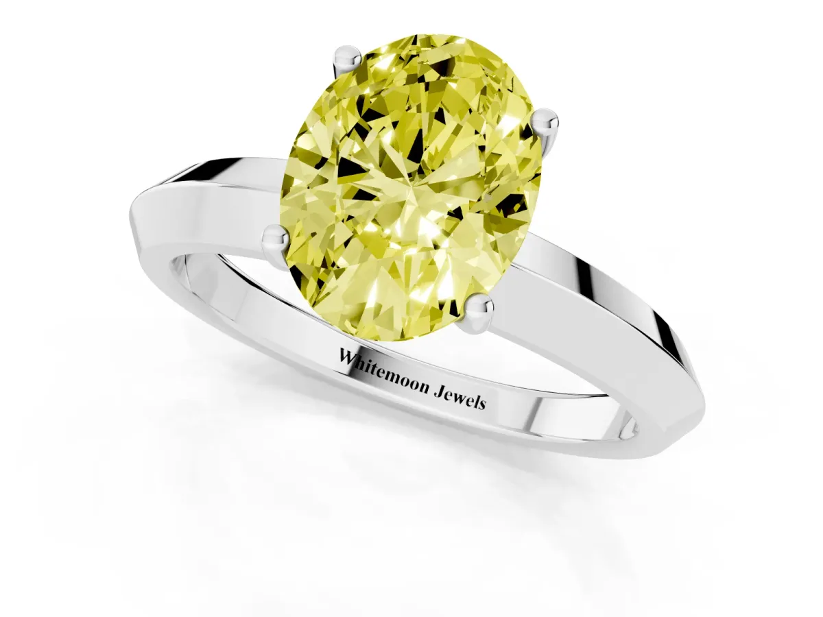Fancy Yellow Oval Cut Cut Solitaire Engagement Ring with Flat Band and Four-Prong Setting Silver