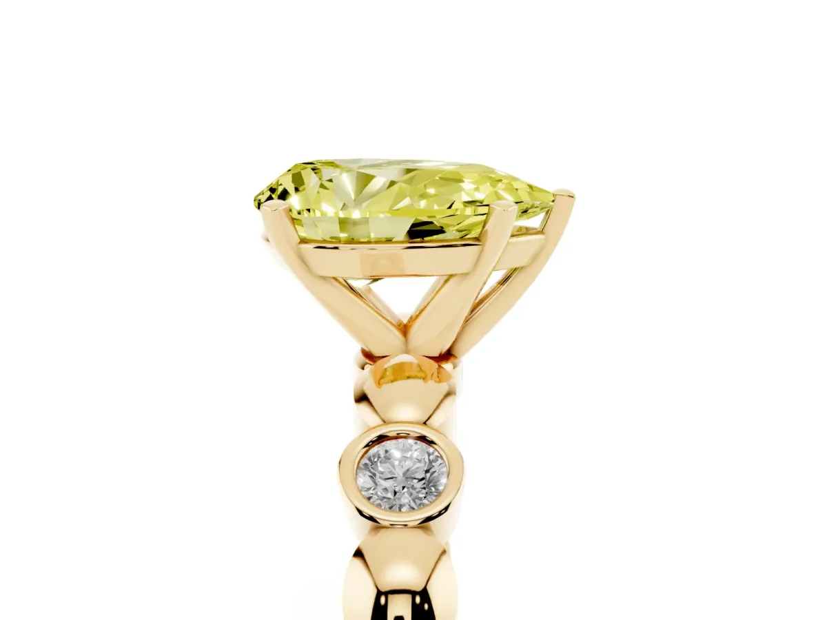 Fancy Yellow Pear Cut Solitaire Bezel-Set Diamond Ring with Beaded Band and Four-Prong Setting Yellow gold