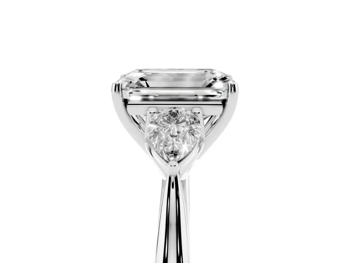 Emerald Cut Diamond Three-Stone Ring with Pear Side Stones and Prong Setting Silver