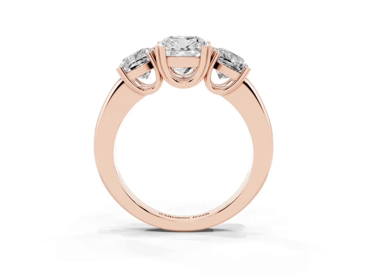Three-Stone Cushion Cut Cut Diamond Ring with Channel Set Band and Four-Prong Setting Rose gold