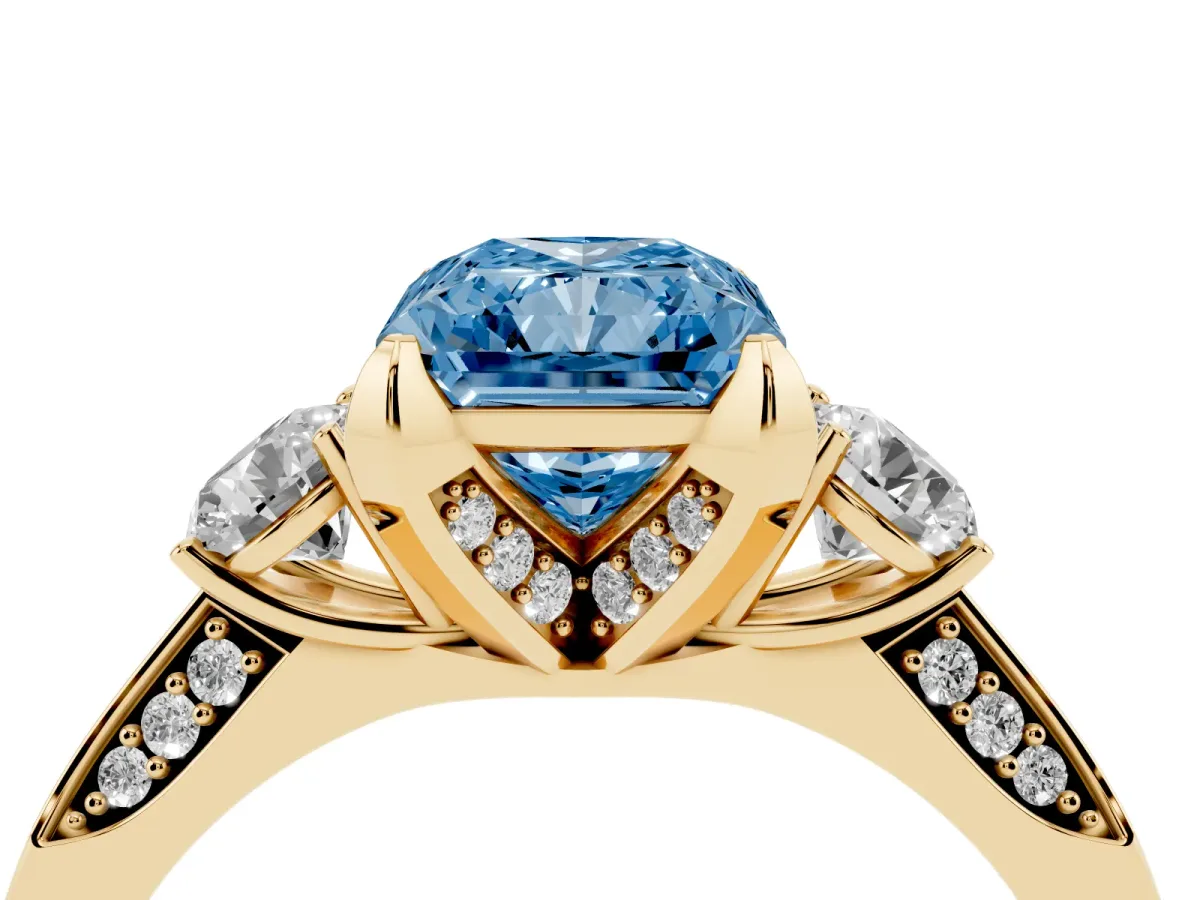 Fancy Blue Radiant Cut Brilliant Three-Stone Diamond Ring with Pavé Band and Four-Prong Setting Yellow gold
