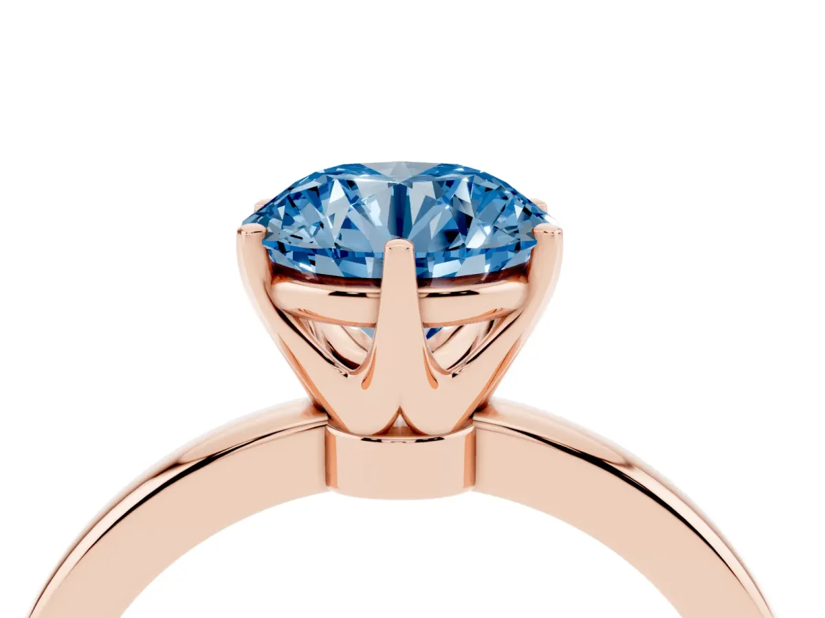 Fancy Blue Round Cut Solitaire Diamond Ring with Six-Prong Setting on a Classic Band Rose gold
