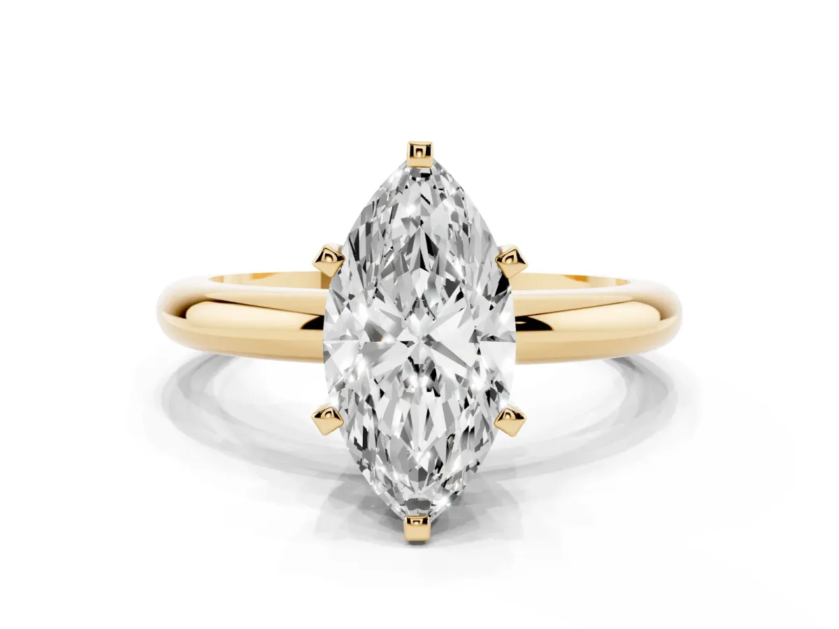 Marquise Cut Diamond Solitaire Engagement Ring with Round Band and Four-Prong Setting Yellow gold