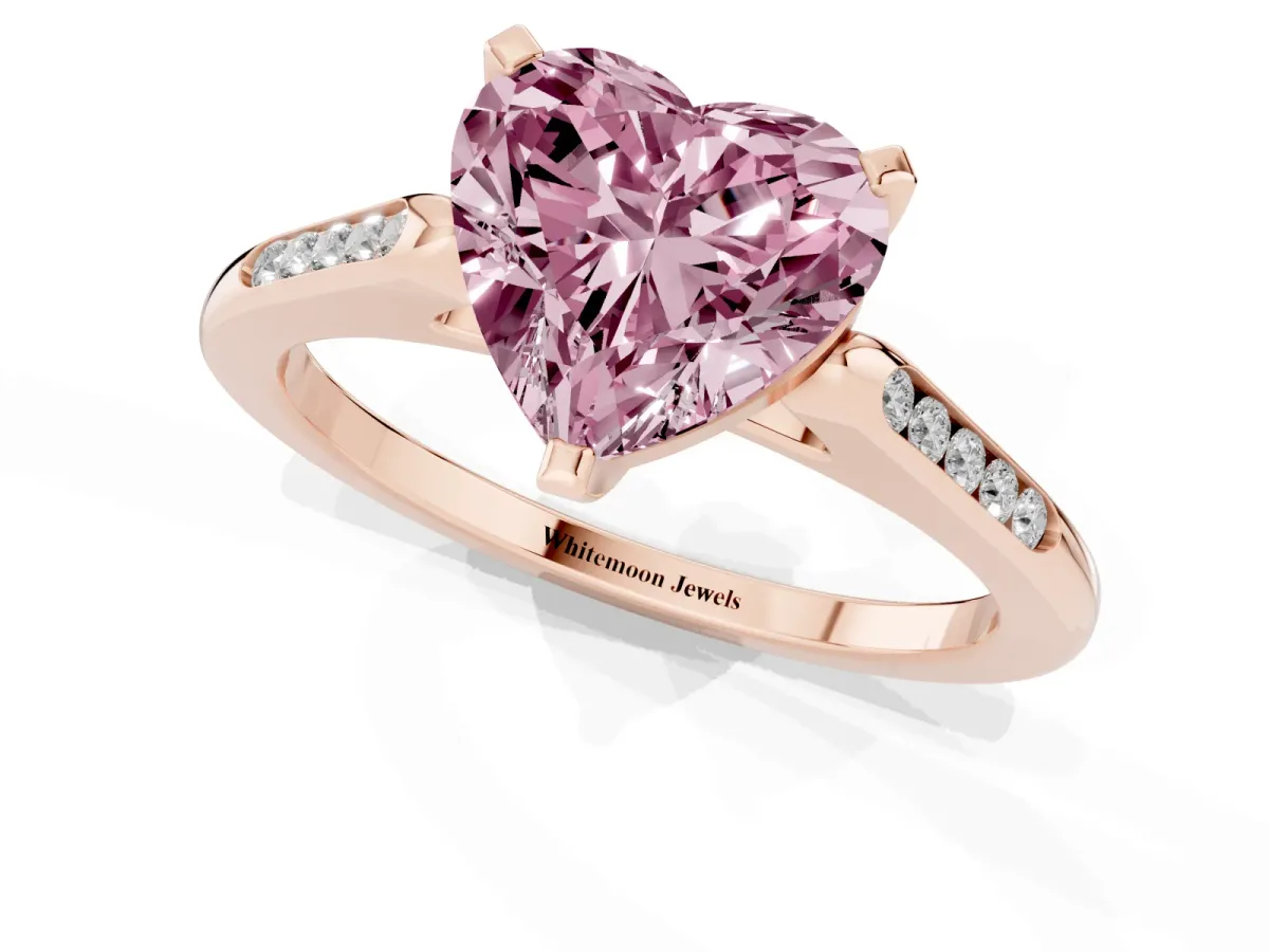 Fancy Pink Heart Cut Diamond Solitaire Ring with Channel Set Round Band and Prong Setting Rose gold