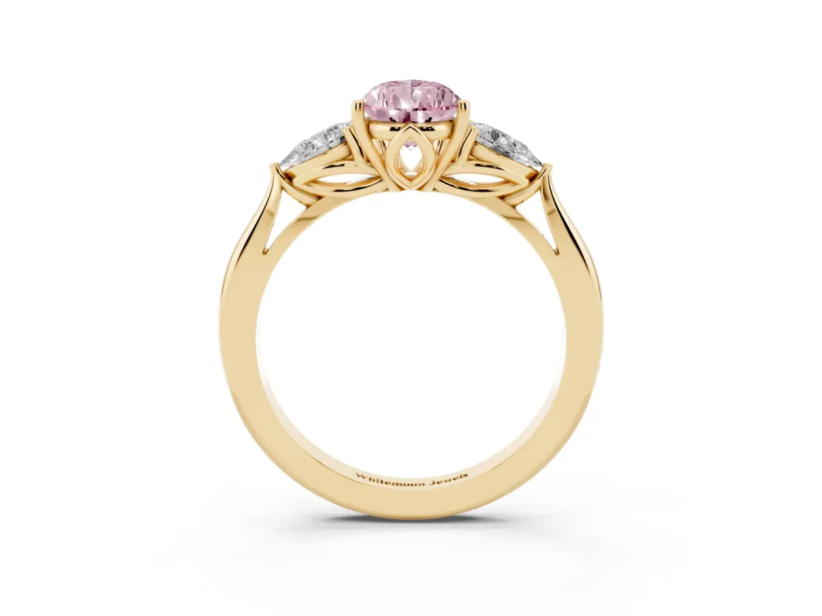 Fancy Pink Three-Stone Pear Cut Brilliant Diamond Solitaire Ring with Tapered Band and Four-Prong Setting Yellow gold