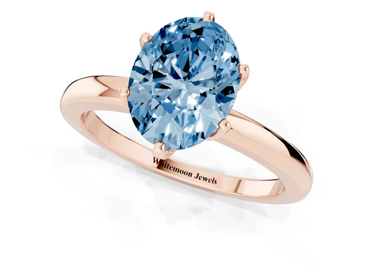 Fancy Blue Oval Cut Solitaire Diamond Ring with Six-Prong Setting on a Classic Band Rose gold