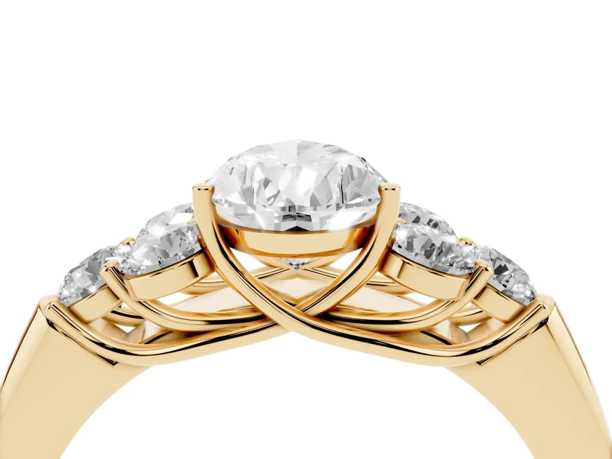 Pear Cut Cut Diamond Cluster Ring with Round Accent Stones and Prong Setting on a Classic Band Yellow gold