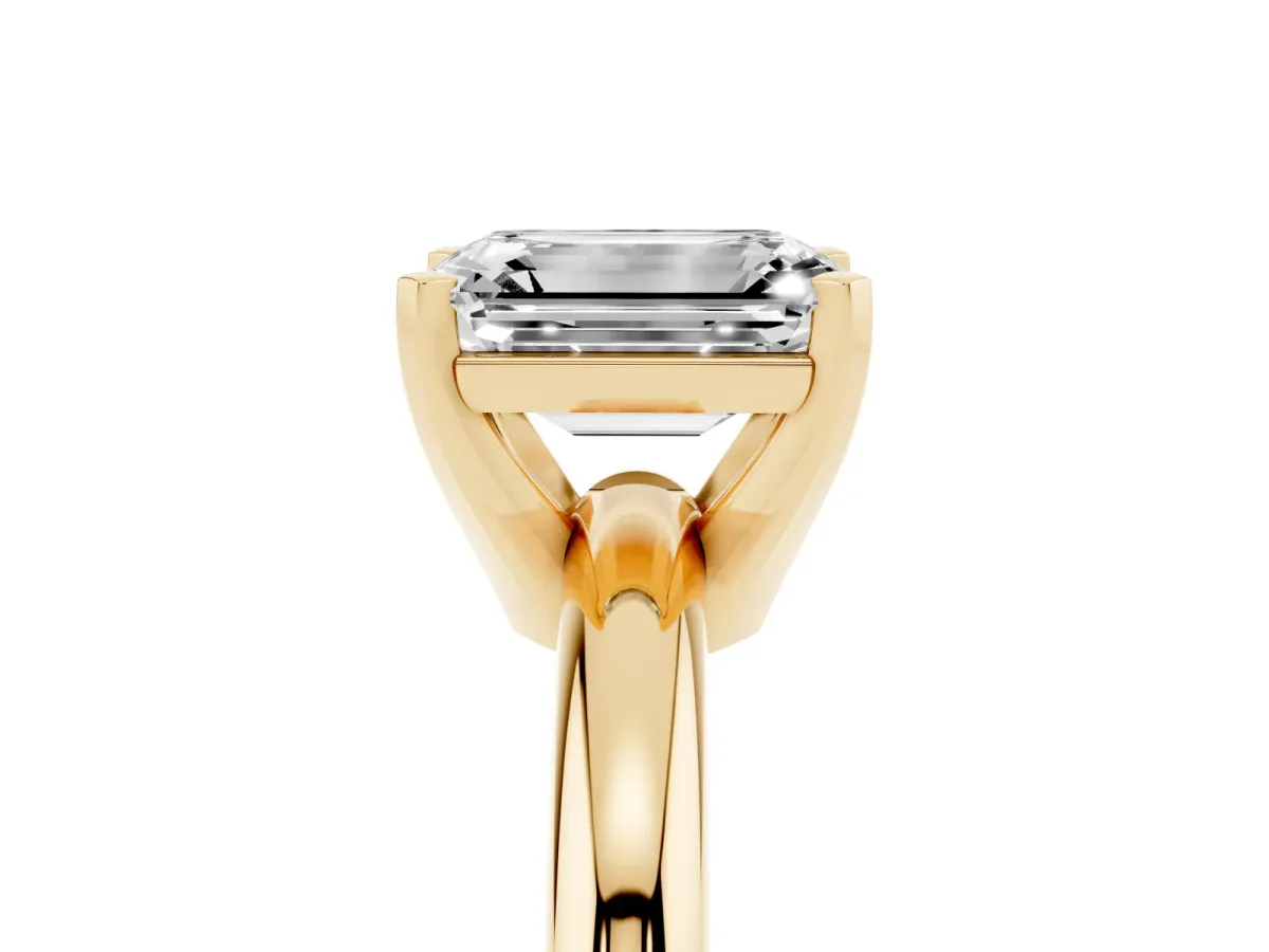Emerald Cut Diamond Solitaire Engagement Ring with Round Band and Four-Prong Setting Yellow gold