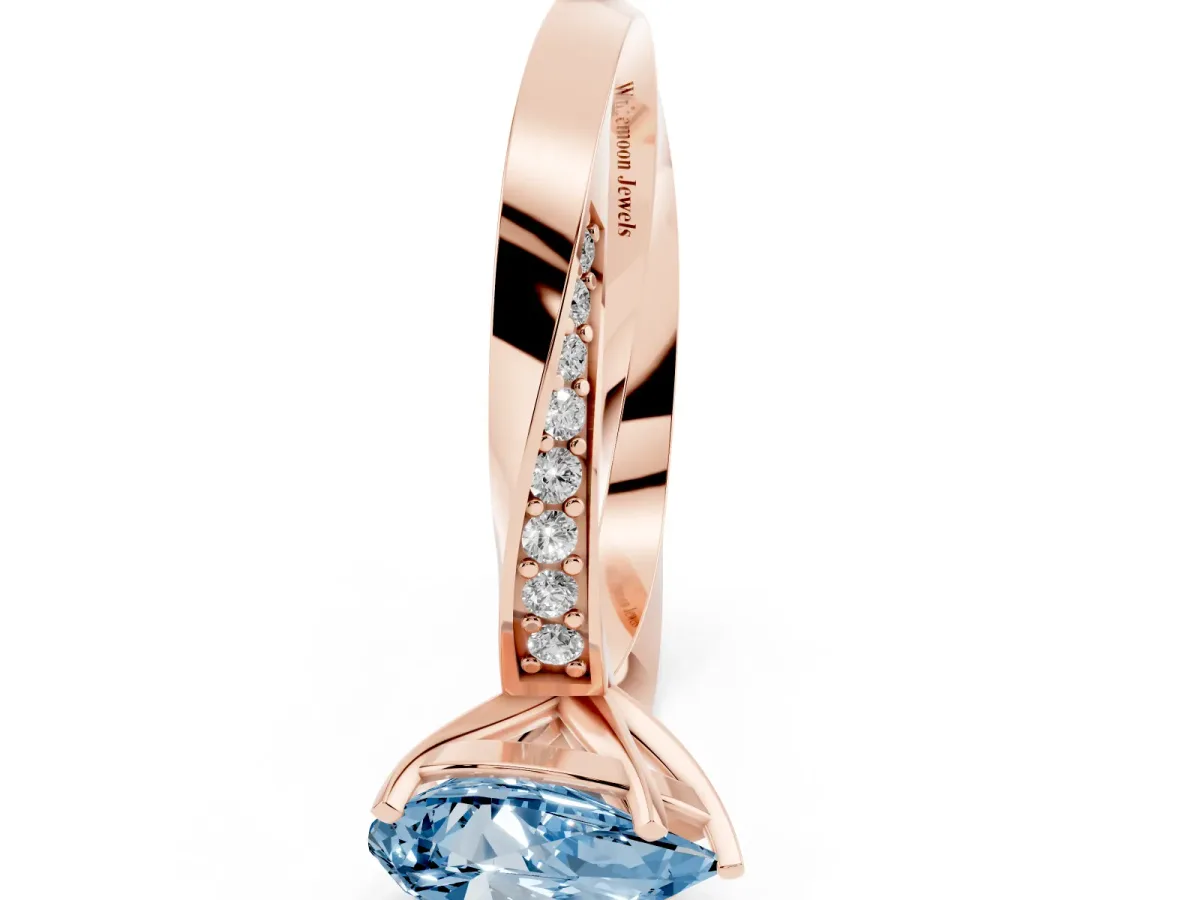 Fancy Blue Pear Cut Diamond Engagement Ring with Side Stone Accents and Four-Prong Setting Rose gold
