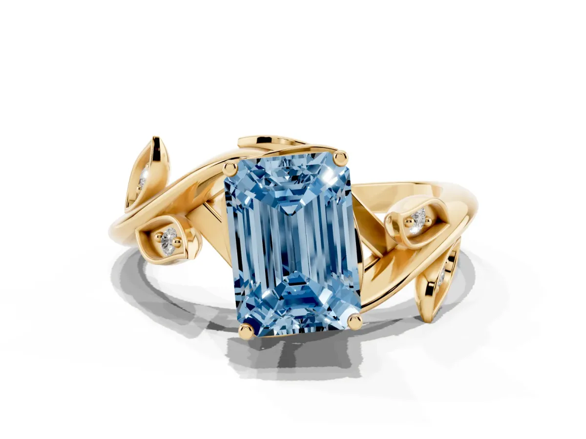Fancy Blue Emerald Cut Solitaire Twist Engagement Ring with Leaf Accents and Prong Setting Yellow gold