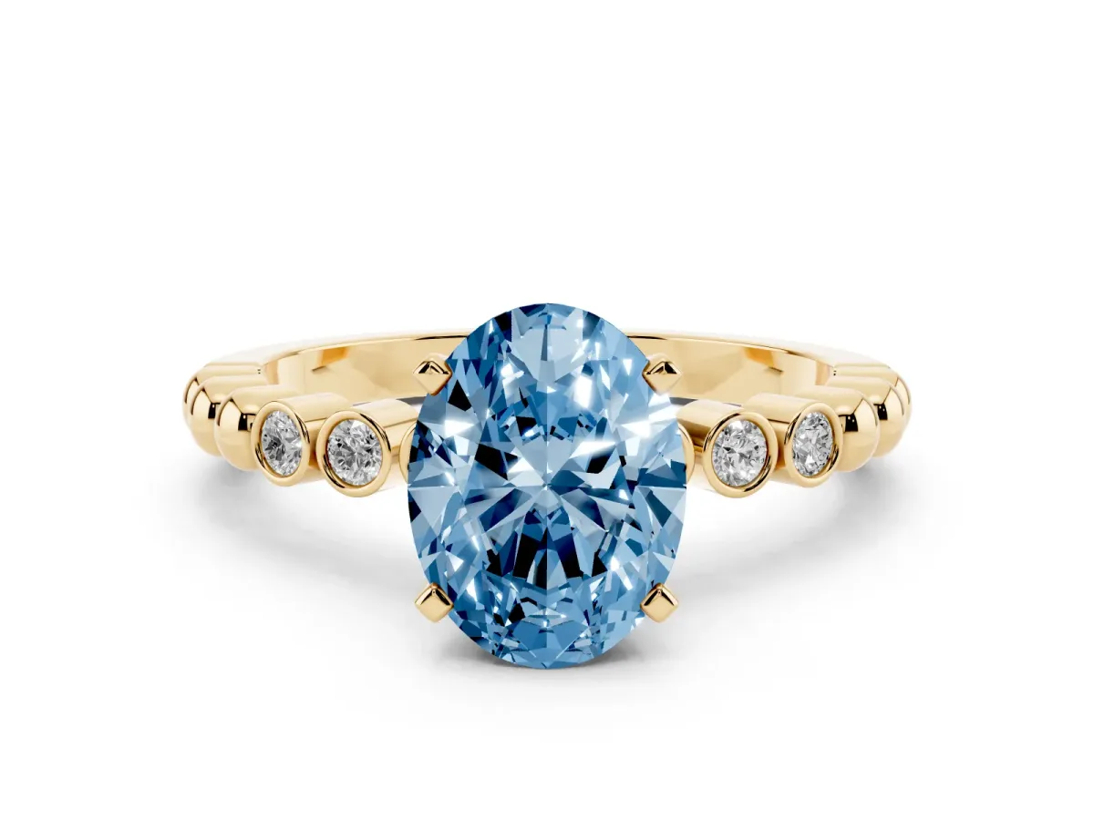Fancy Blue Oval Cut Solitaire Bezel Accent Diamond Engagement Ring with Beaded Band and Four-Prong Setting Yellow gold