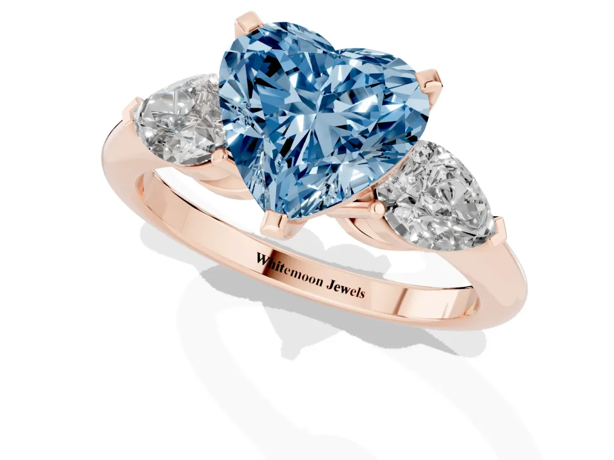 Fancy Blue Three-Stone Heart Cut Diamond Ring with Pear Side Stones and Four-Prong Setting Rose gold