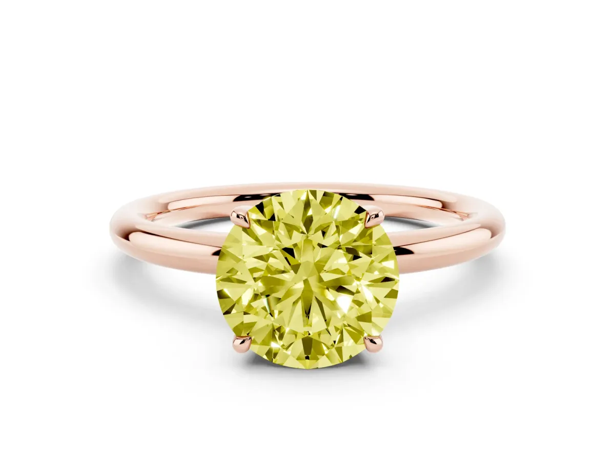 Fancy Yellow Round Cut Diamond Solitaire Ring with Thin Band and Four-Prong Setting Rose gold