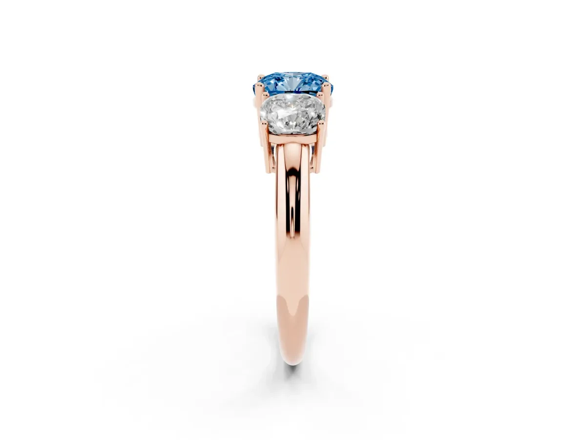 Fancy Blue Three-Stone Cushion Cut Cut Diamond Engagement Ring with Prong Setting on a White Gold Band Rose gold