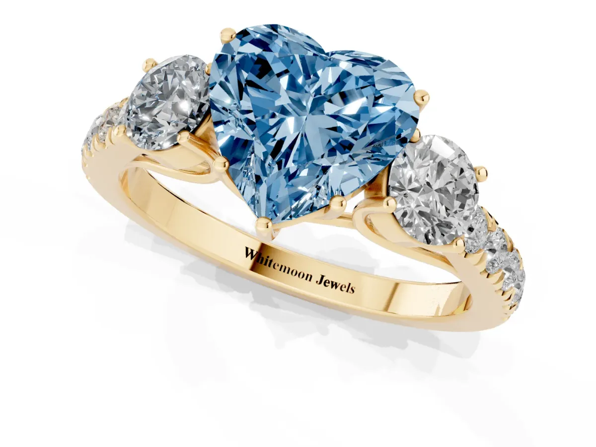 Fancy Blue Heart Cut Cut Diamond Three-Stone Ring with Round Side Stones and Pavé Band Yellow gold