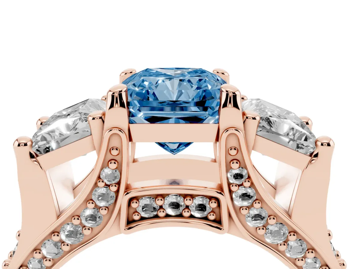 Fancy Blue Radiant Cut Diamond Three-Stone Ring with Channel Set Band and Four-Prong Setting Rose gold