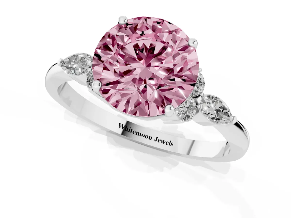 Fancy Pink Round Cut Brilliant Diamond Solitaire Ring with Pear Side Stones and Four-Prong Setting White gold