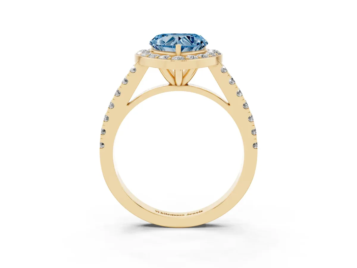 Fancy Blue Heart Cut Diamond Halo Ring with Round Pavé Split Shank and Prong Setting Yellow gold