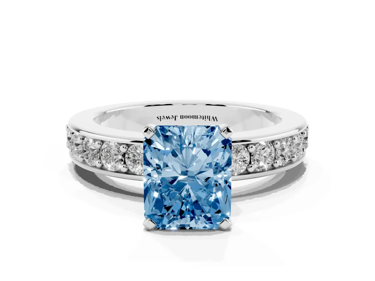 Fancy Blue Radiant Cut Diamond Engagement Ring with Channel Set Round Band and Prong Setting Silver