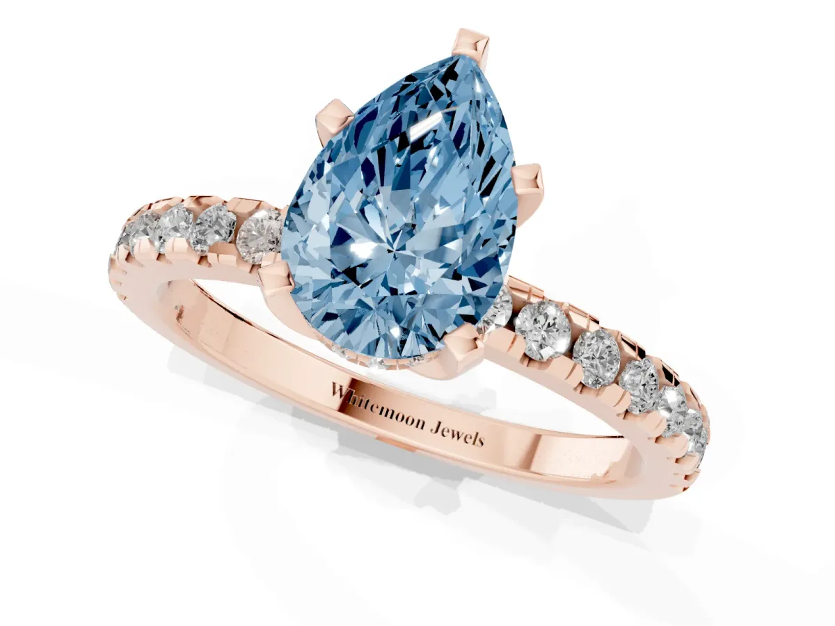 Fancy Blue Pear Cut Diamond Solitaire Ring with Round Pavé Band and Four-Prong Setting Rose gold