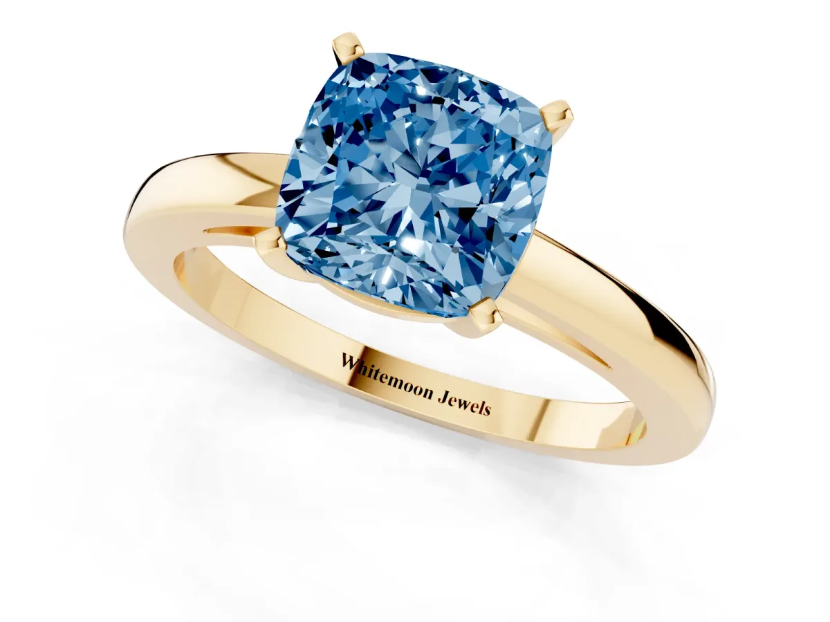 Fancy Blue Cushion Cut Solitaire Diamond Engagement Ring with Four-Prong Setting on a Classic Band Yellow gold