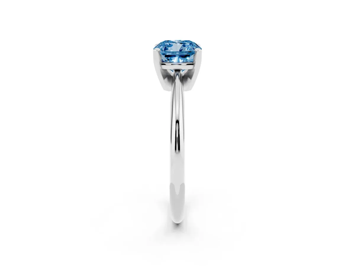 Fancy Blue Cushion Cut Cut Solitaire Ring with Four-Prong Setting on a Classic Band Silver