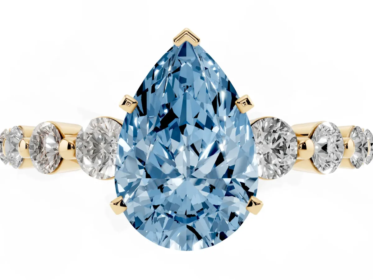 Fancy Blue Pear Cut Solitaire Diamond Ring with Pave Band and Four-Prong Setting Yellow gold