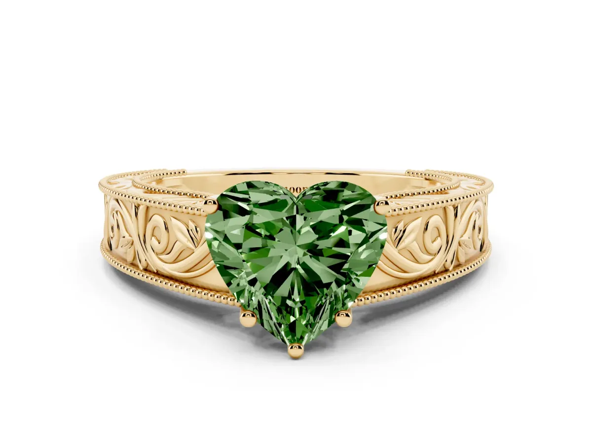 Fancy Green Heart Cut Diamond Solitaire Ring with Engraved Band and Four-Prong Setting Yellow gold