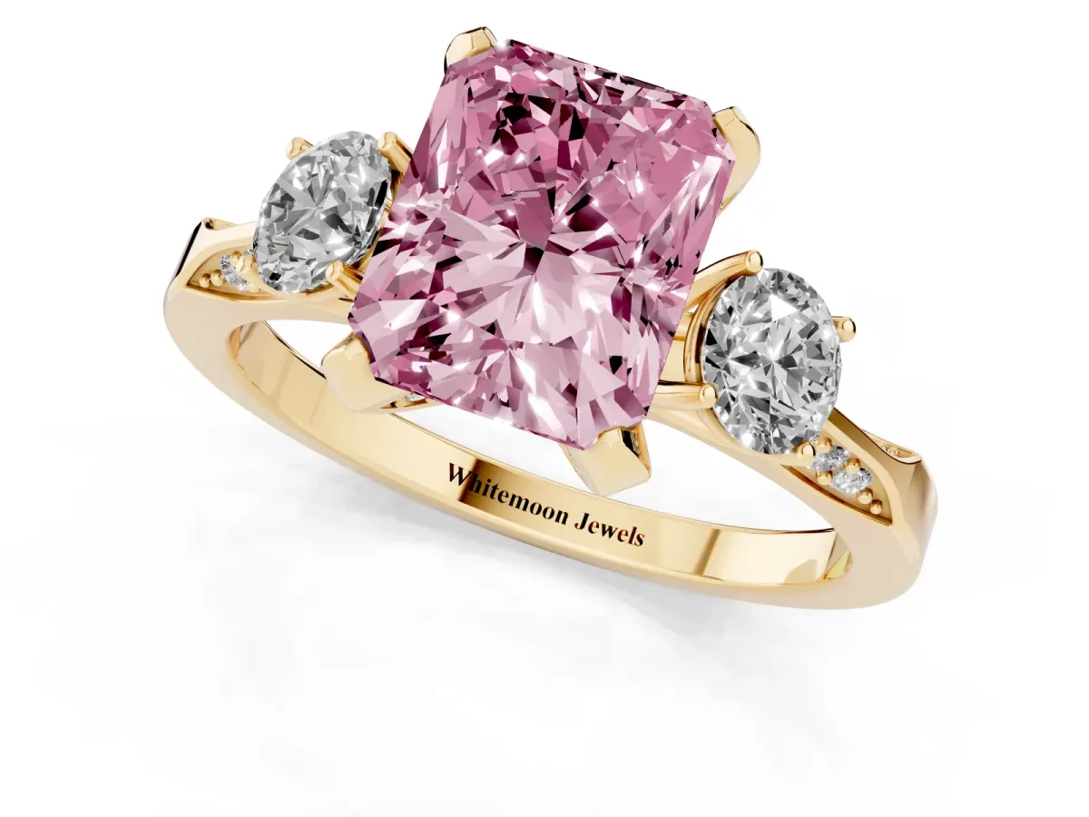 Fancy Pink Radiant Cut Brilliant Three-Stone Diamond Ring with Pavé Band and Four-Prong Setting Yellow gold