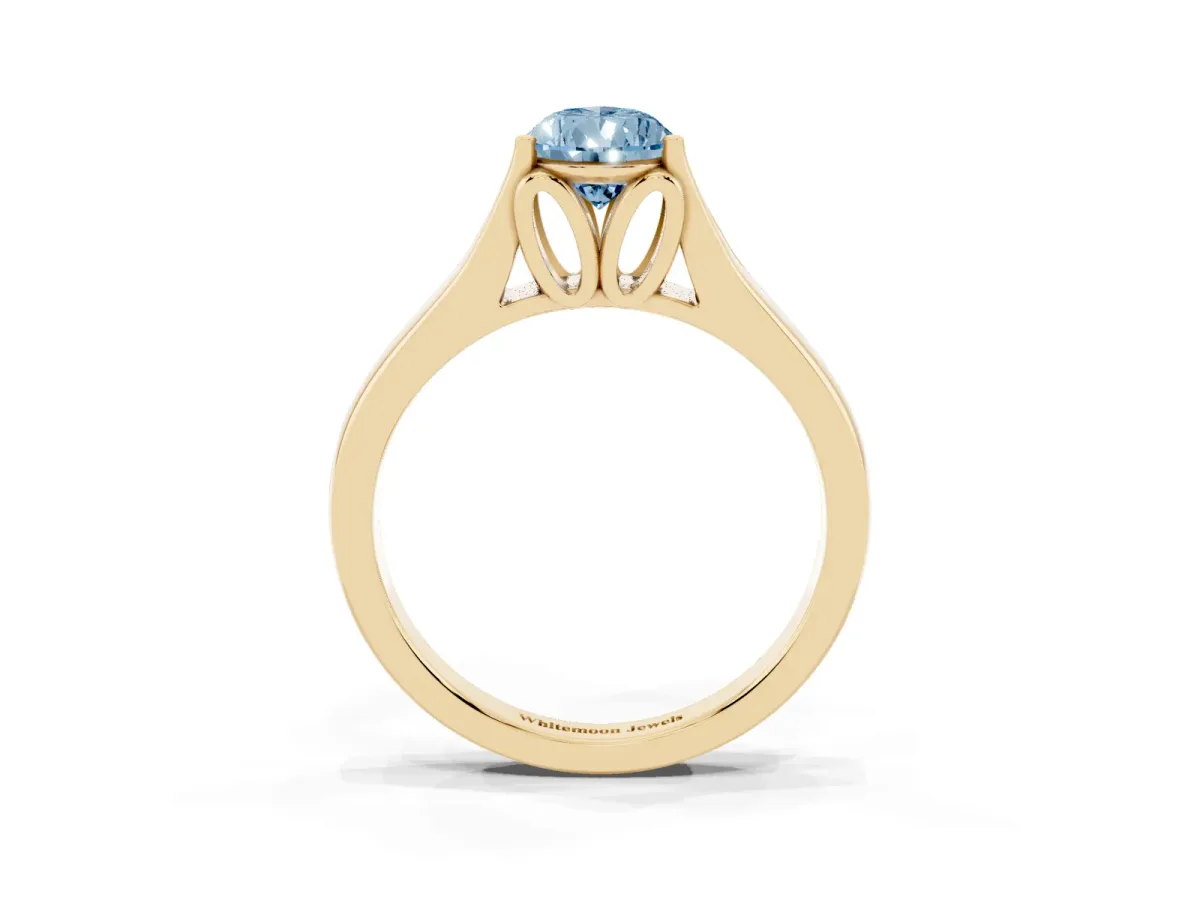 Fancy Blue Pear Cut Solitaire Diamond Ring with Cathedral Band and Four-Prong Setting Yellow gold