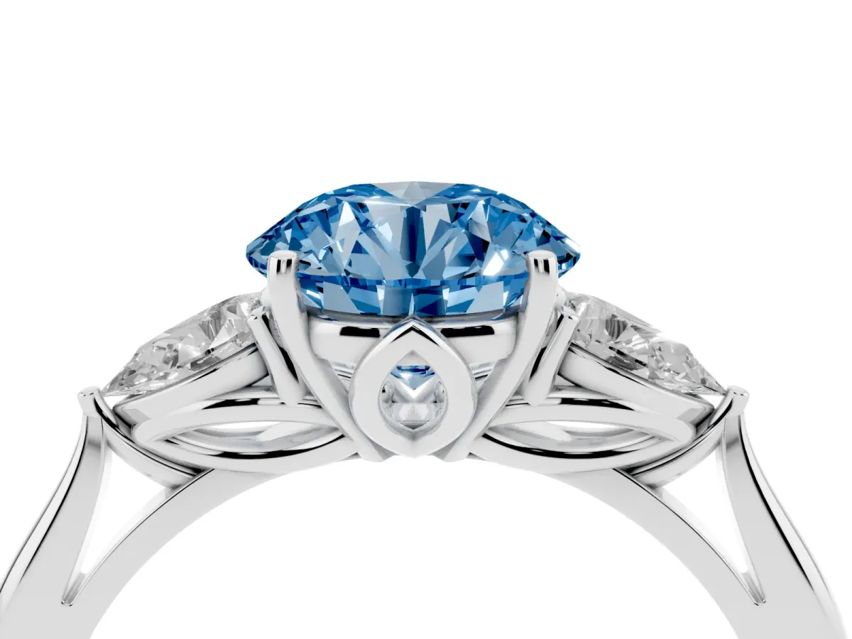 Fancy Blue Round Cut Diamond Three-Stone Ring with Pear Side Stones and Prong Setting Platinum