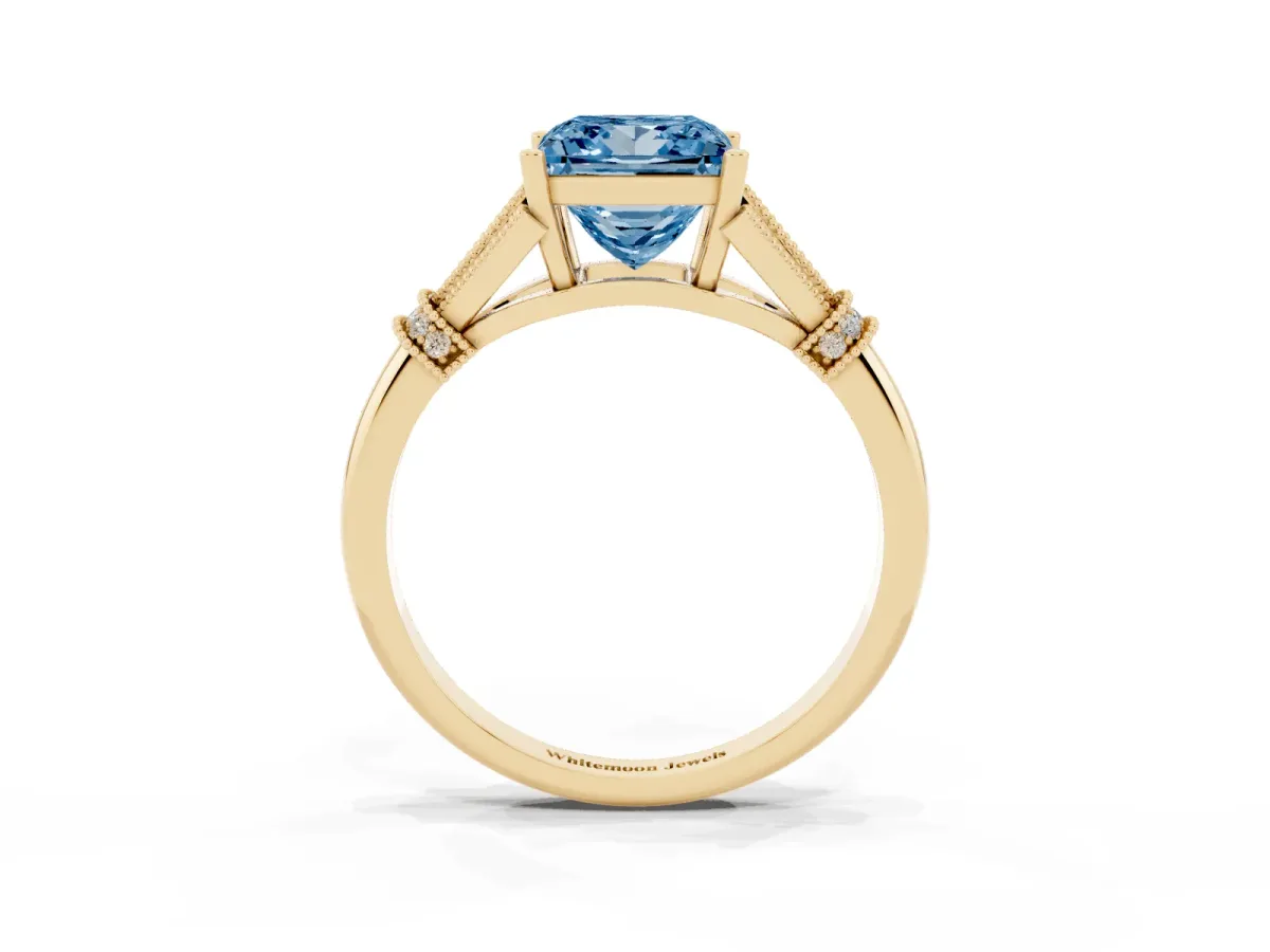 Fancy Blue Princess Cut Diamond Solitaire Ring with Floral Filigree and Pave Accents Yellow gold