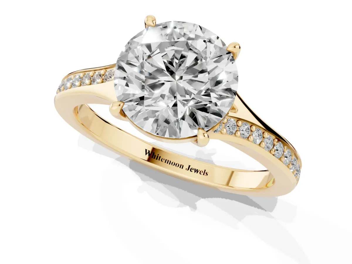 Round Cut Diamond Solitaire Ring with Pavé Band and Prong Setting Yellow gold