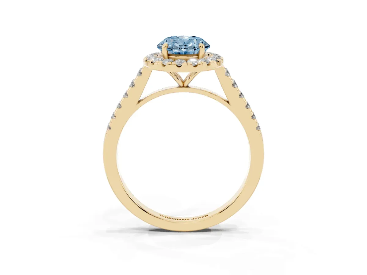 Fancy Blue Oval Cut Halo Pave Diamond Engagement Ring with Four-Prong Setting Yellow gold
