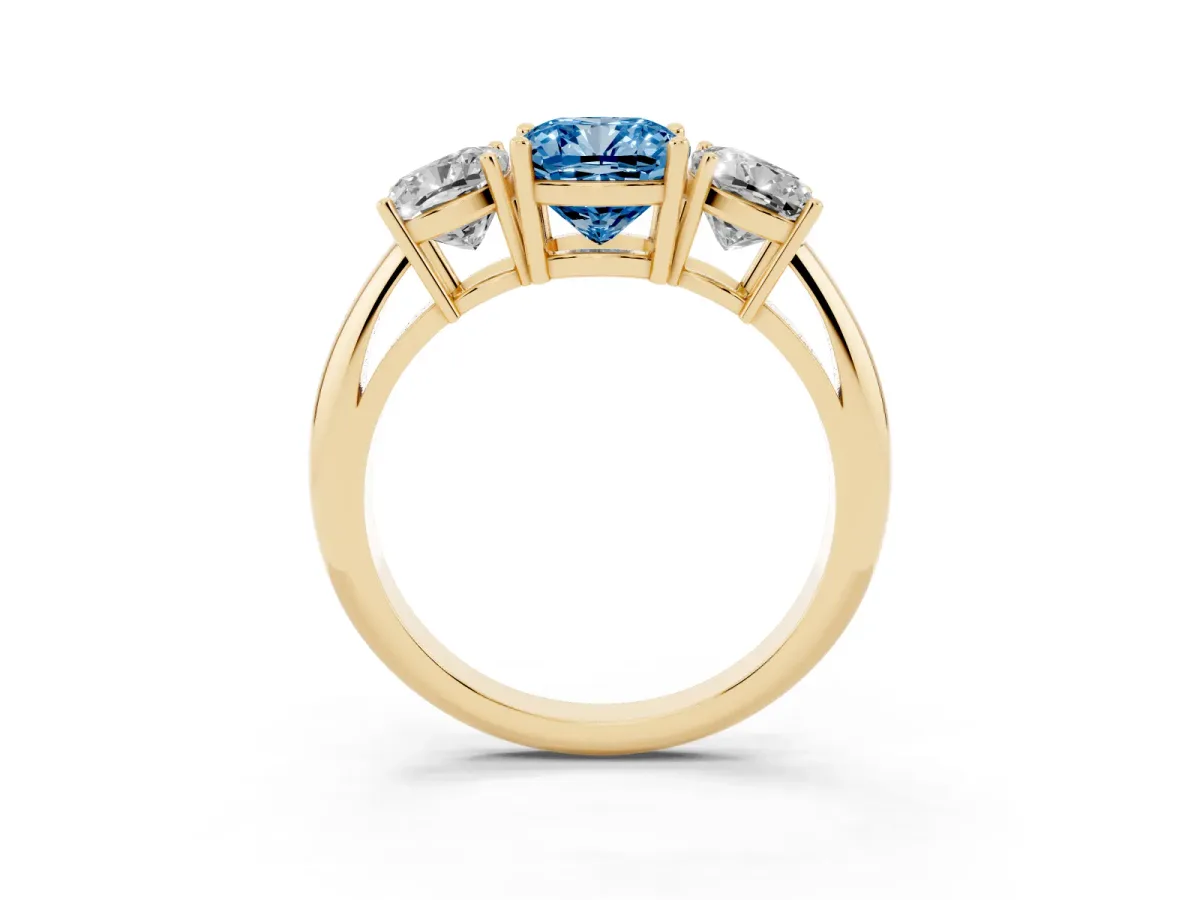 Fancy Blue Three-Stone Cushion Cut Cut Diamond Engagement Ring with Prong Setting on a White Gold Band Yellow gold