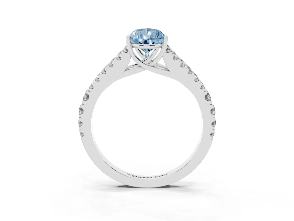 Fancy Blue Pear Cut Diamond Split Shank Engagement Ring with Round Pavé and Prong Setting Platinum