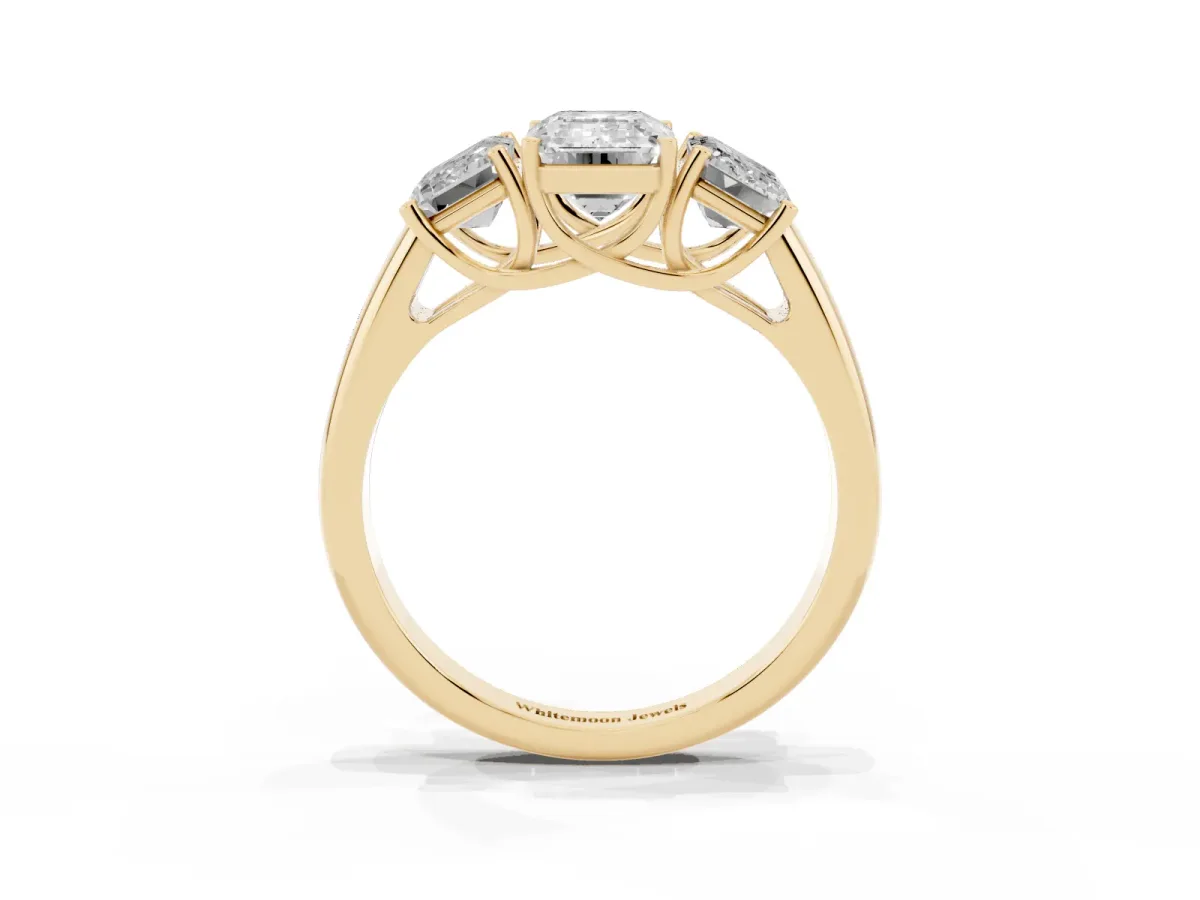 Three-Stone Emerald Cut Diamond Engagement Ring with Prong Setting Yellow gold