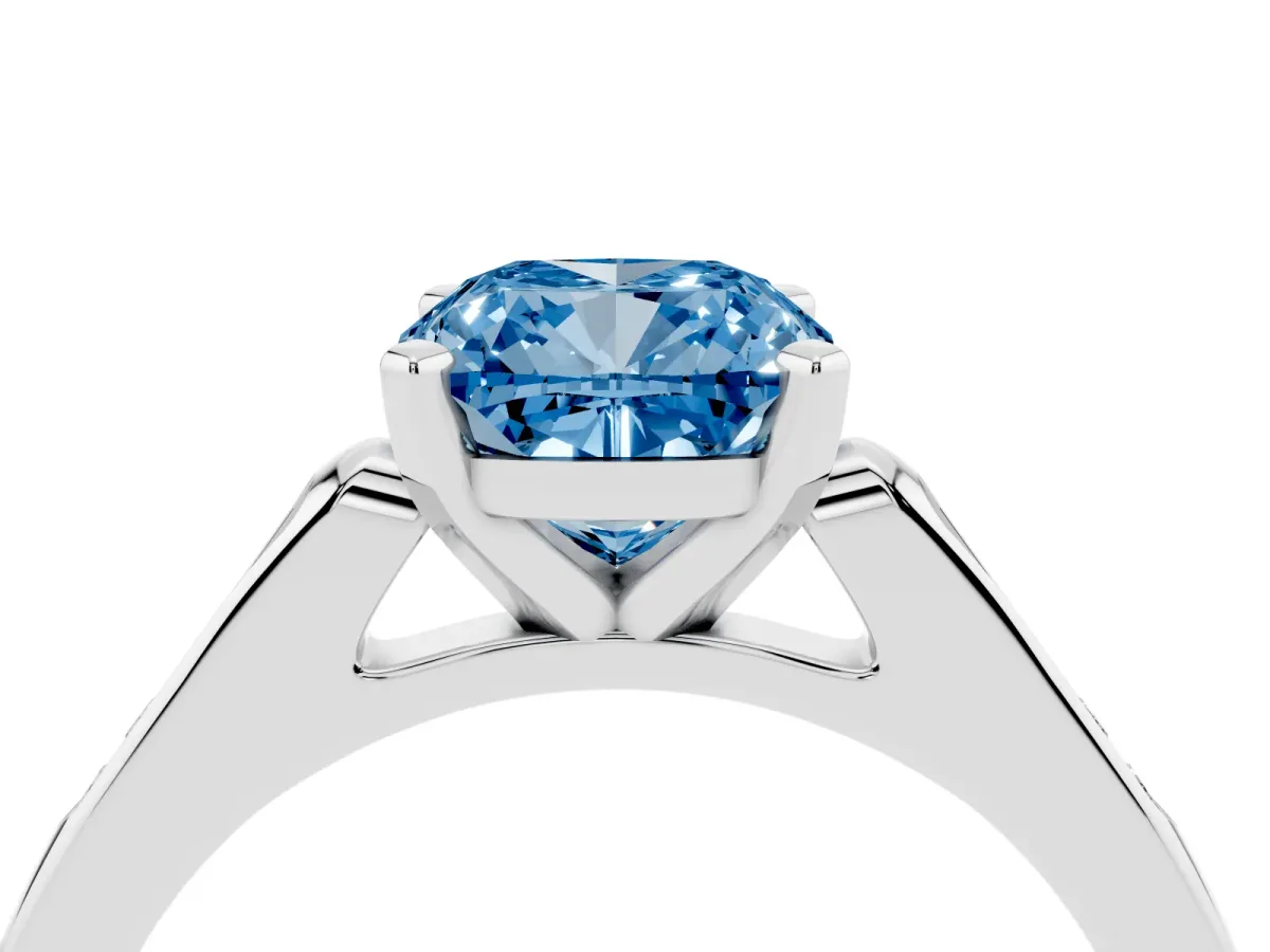 Fancy Blue Cushion Cut Diamond Solitaire Ring with Channel Set Round Band and Prong Setting Silver