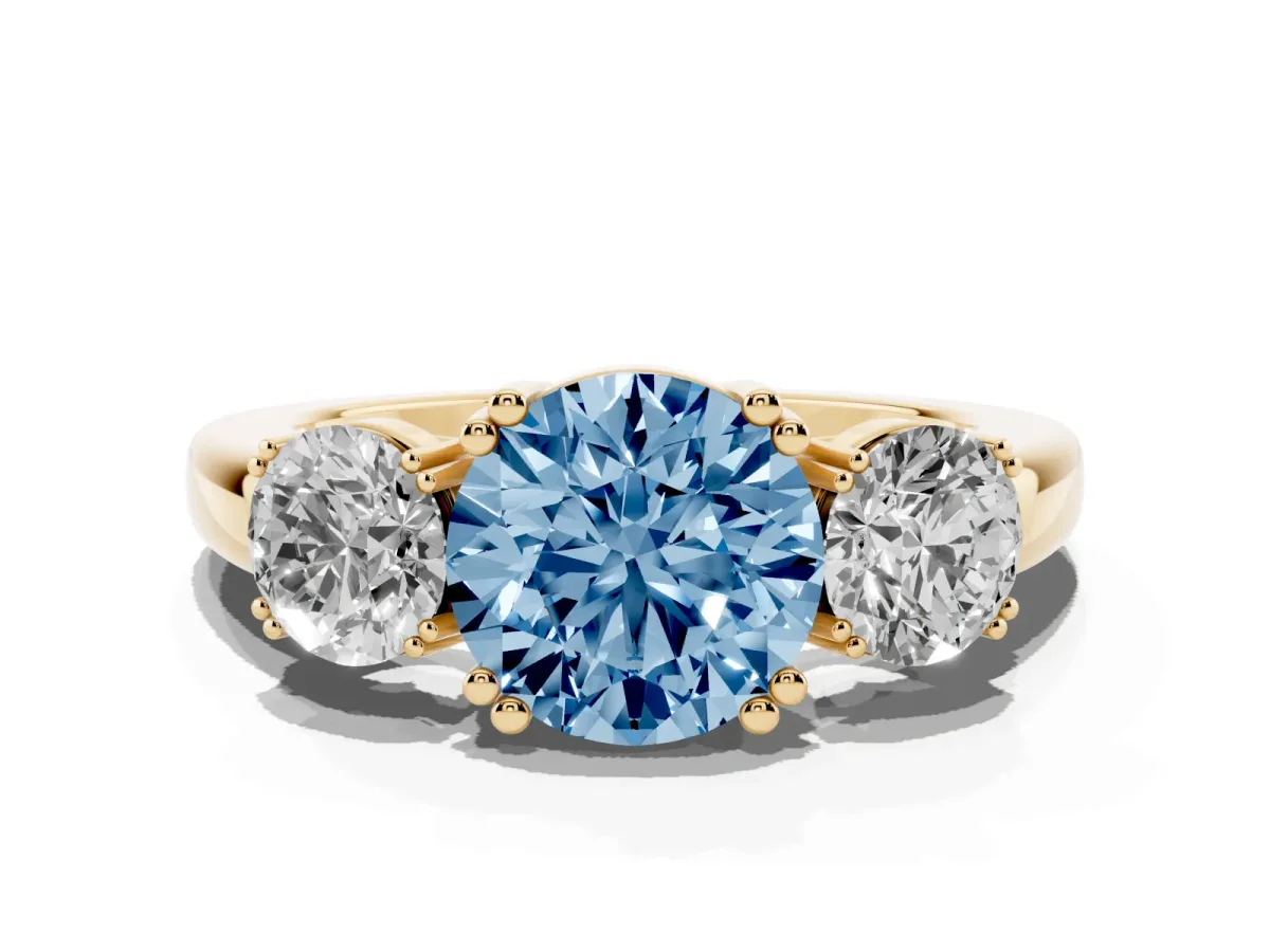 Fancy Blue Three-Stone Round Cut Cut Diamond Ring with Channel Set Band and Four-Prong Setting Yellow gold