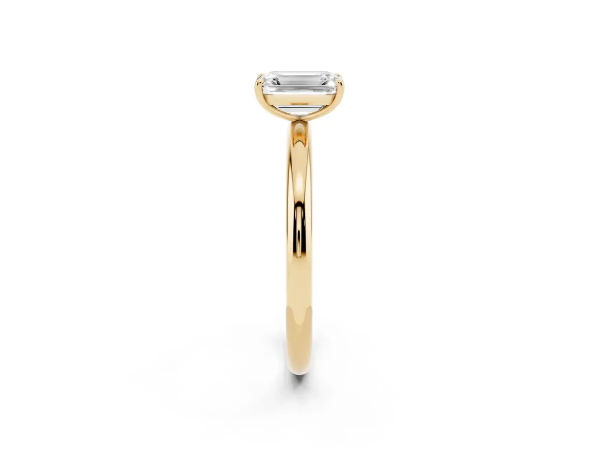 Emerald Cut Solitaire Diamond Ring with Four-Prong Setting on a Plain Band Yellow gold