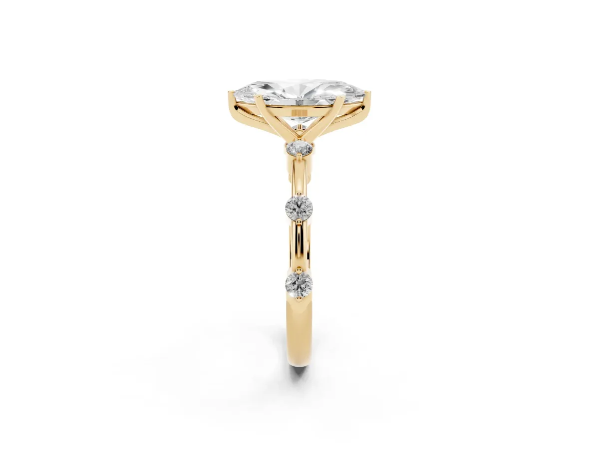 Marquise Cut Solitaire Diamond Ring with Bezel Set Side Stones and Prong Setting Yellow gold