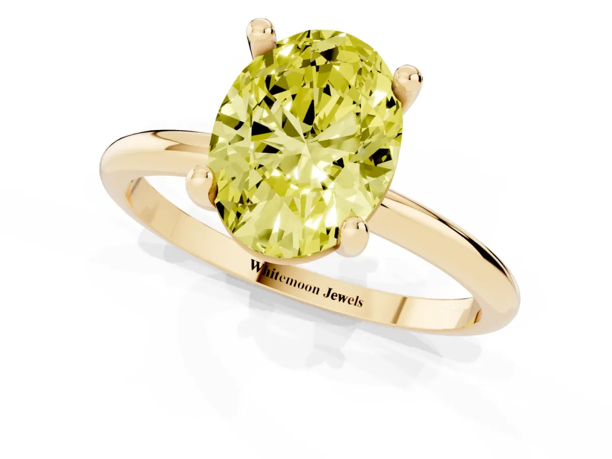 Fancy Yellow Oval Cut Solitaire Diamond Ring with 4-Prong Setting on a Classic Band Yellow gold