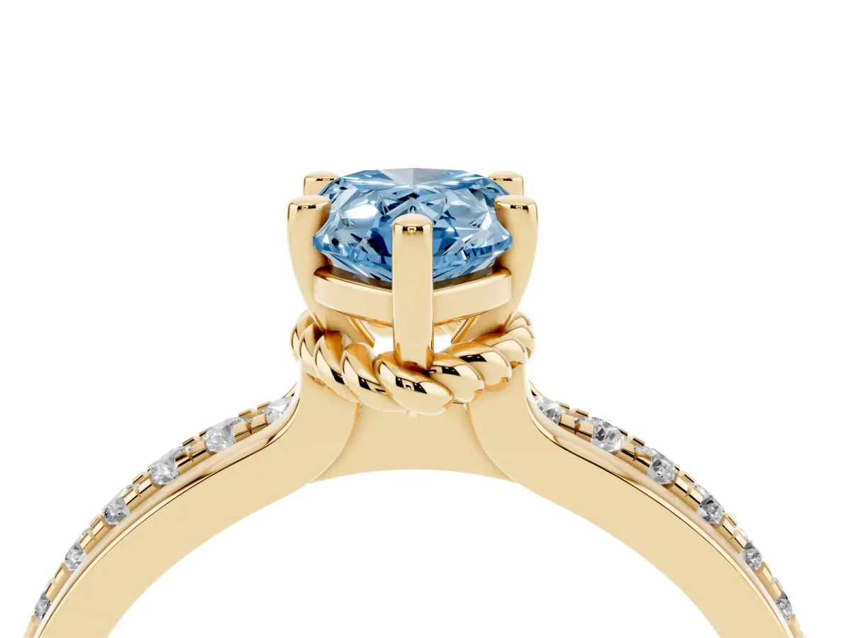 Fancy Blue Pear Cut Solitaire Diamond Ring with Channel Set Band and Six-Prong Setting Yellow gold