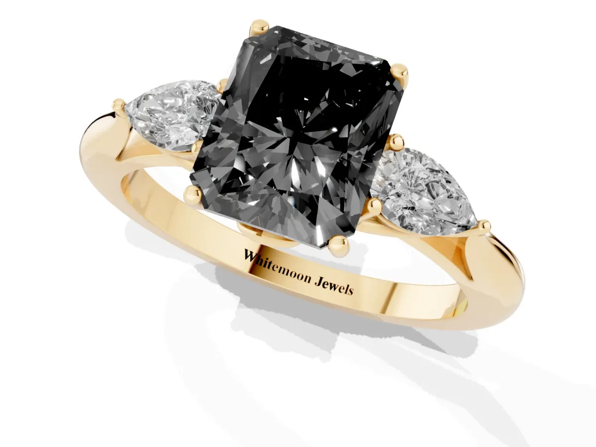 Fancy Black Three-Stone Radiant Cut Brilliant Diamond Solitaire Ring with Tapered Band and Four-Prong Setting Yellow gold