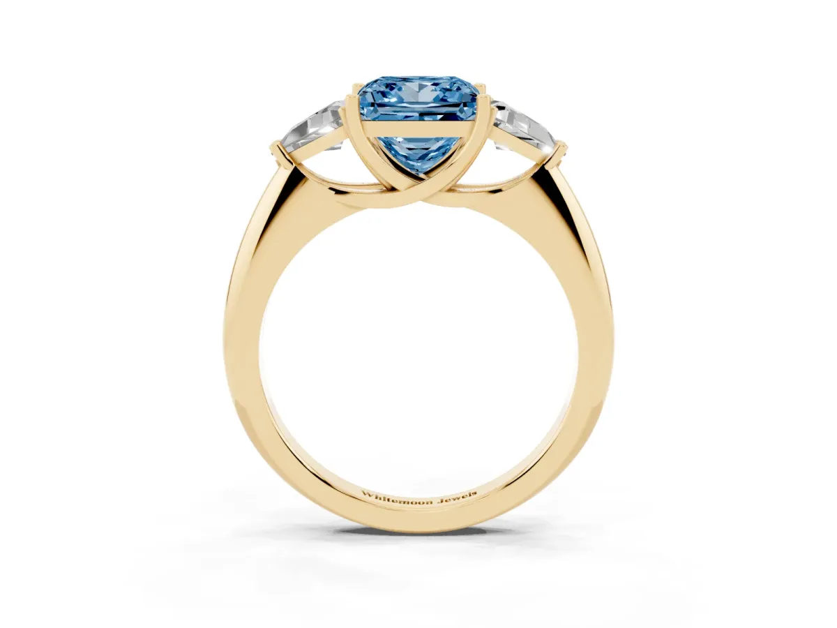Fancy Blue Three-Stone Princess Cut Diamond Engagement Ring with Trillion Side Stones and Prong Setting Yellow gold