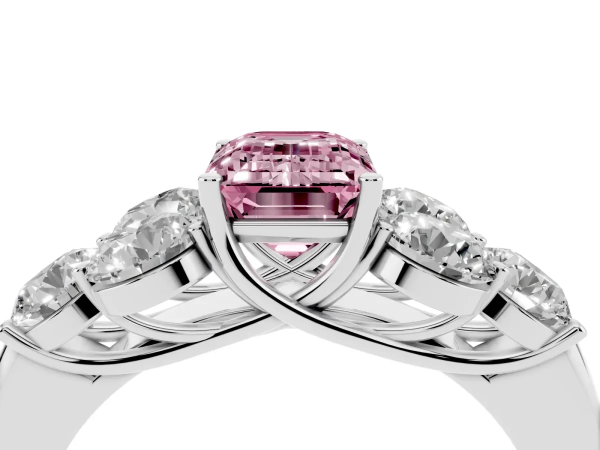 Fancy Pink Emerald Cut Cut Diamond Cluster Ring with Round Accent Stones and Prong Setting on a Classic Band Silver