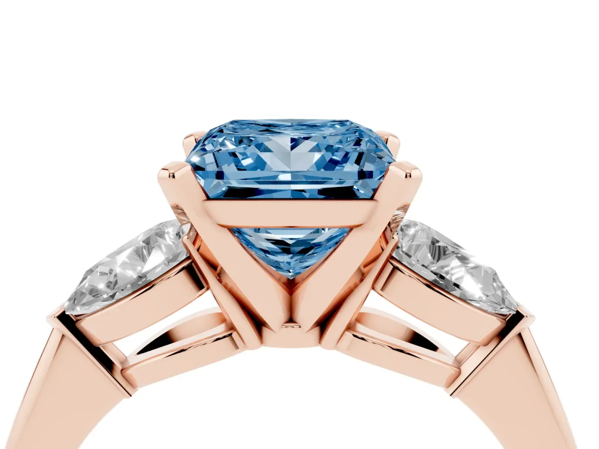 Fancy Blue Three-Stone Princess Cut Diamond Ring with Pear Side Stones and Four-Prong Setting Rose gold